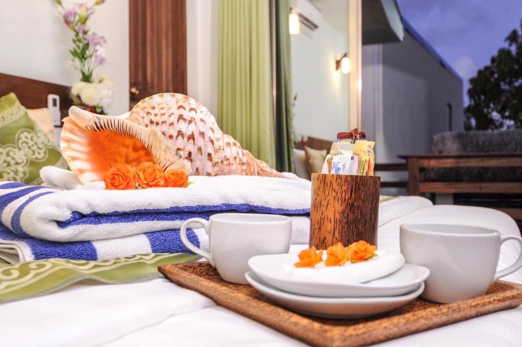 Postel nebo postele na pokoji v ubytování Salt Beach Hotel