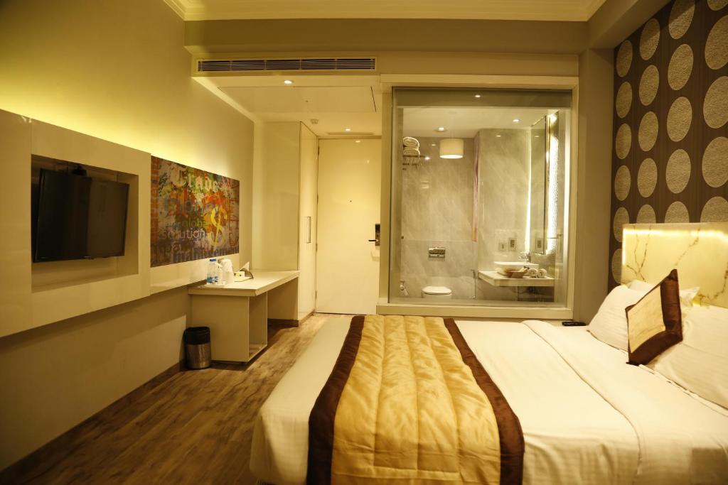 Postel nebo postele na pokoji v ubytování Hotel Orange