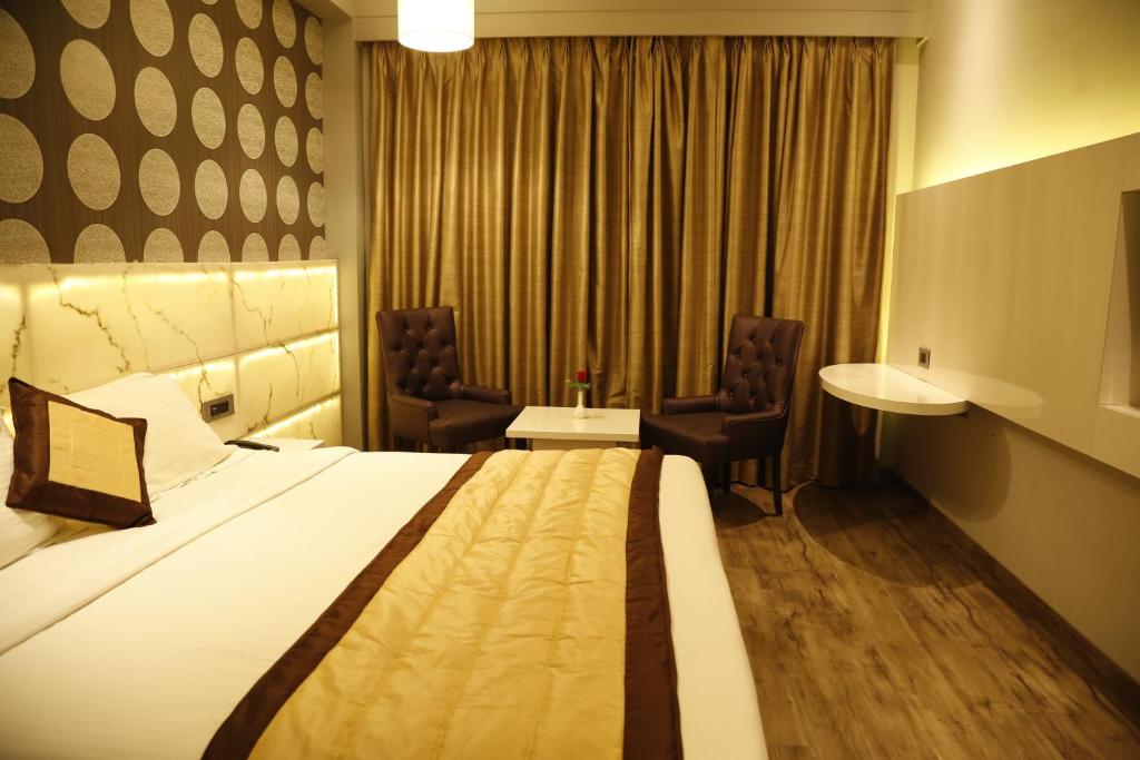 Postel nebo postele na pokoji v ubytování Hotel Orange