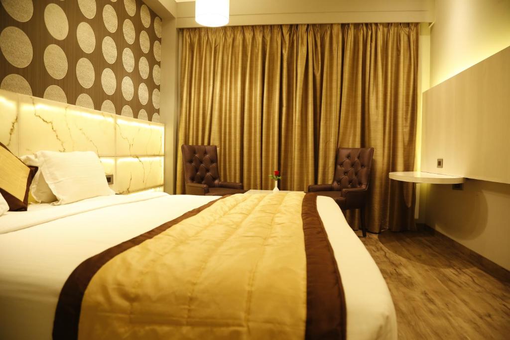 Postel nebo postele na pokoji v ubytování Hotel Orange