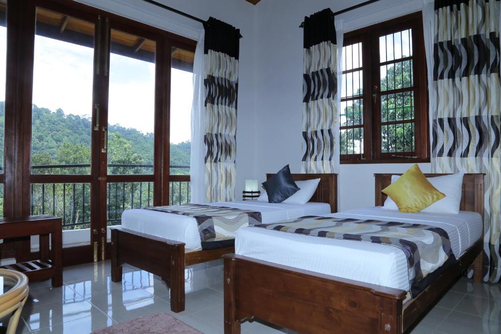 Postel nebo postele na pokoji v ubytování The Springfields Kandy Previously Madara Residence Kandy