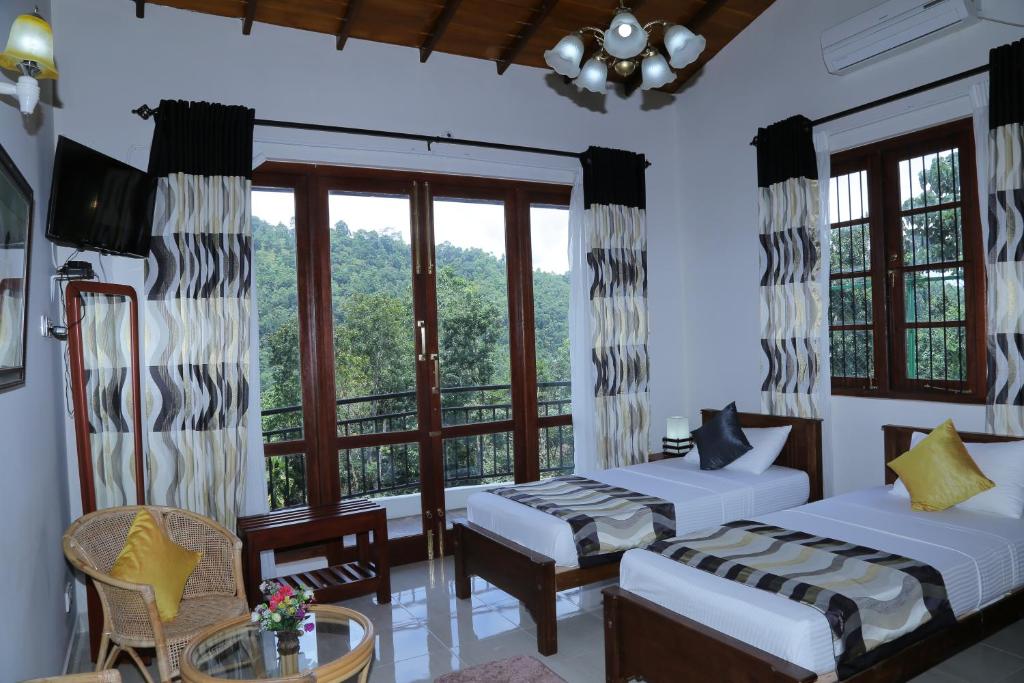Postel nebo postele na pokoji v ubytování The Springfields Kandy Previously Madara Residence Kandy