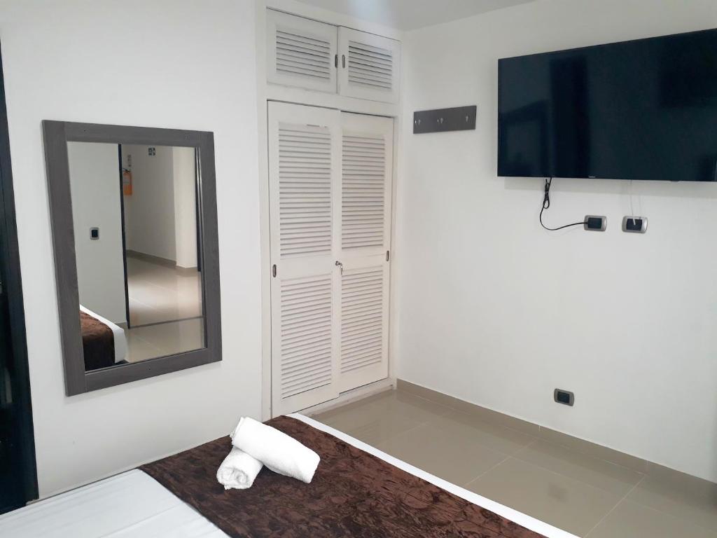 Postel nebo postele na pokoji v ubytování Hotel Jardin de Laureles Jeps