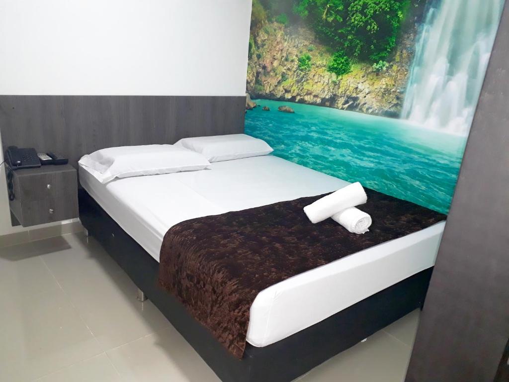 Postel nebo postele na pokoji v ubytování Hotel Jardin de Laureles Jeps