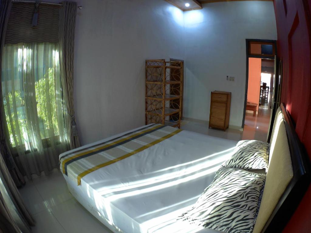Postel nebo postele na pokoji v ubytování Eddie's Homestay
