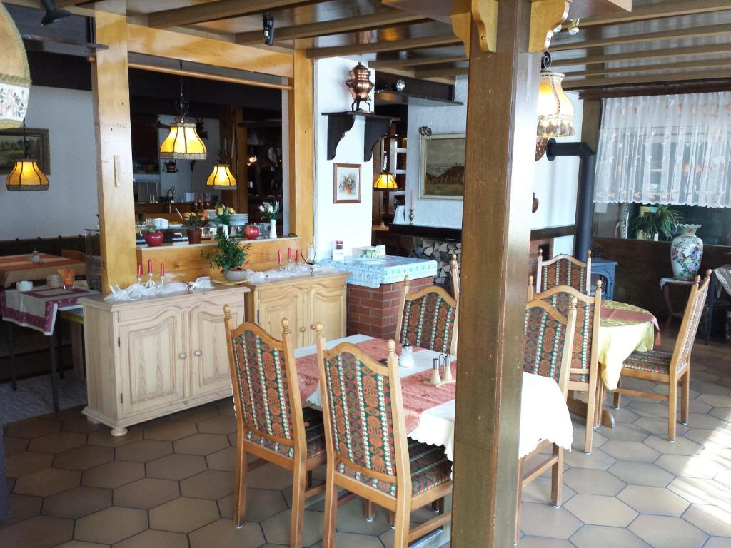a dining room with a table and chairs at Hotel-Pension Waldeck in Todtmoos