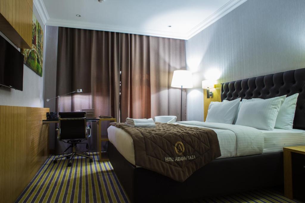 Postel nebo postele na pokoji v ubytování Aidana Plaza Hotel