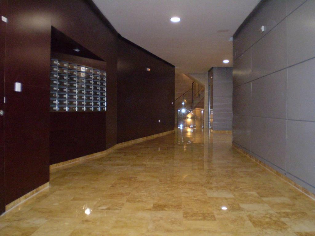 an empty hallway of a building with a building at Primera Linea de Mar in Torrevieja