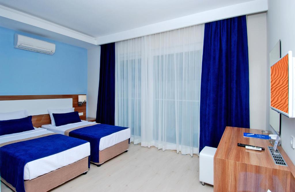 Postel nebo postele na pokoji v ubytování Kleopatra Ramira Hotel - All Inclusive