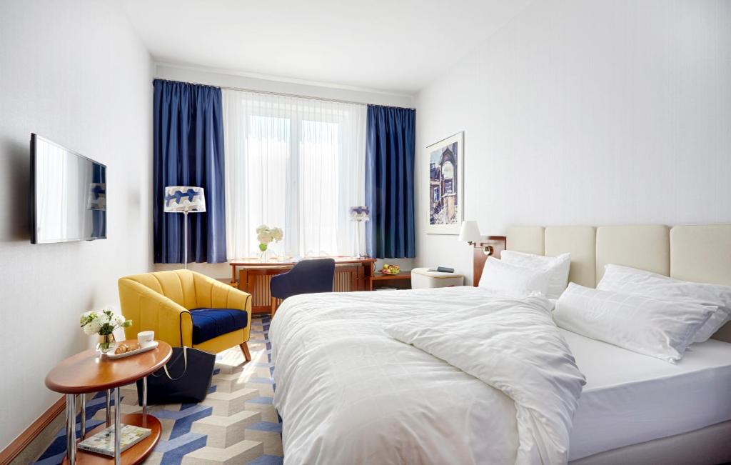 Postel nebo postele na pokoji v ubytování Seaside Park Hotel Leipzig