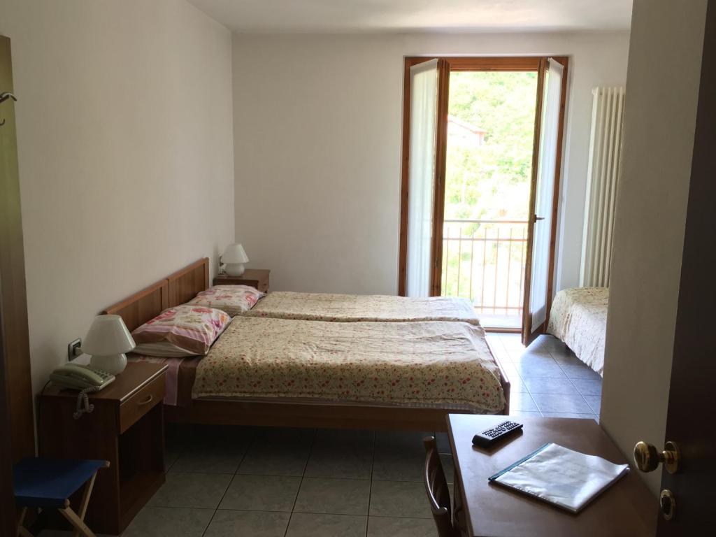 Postel nebo postele na pokoji v ubytování Hotel Cavaria