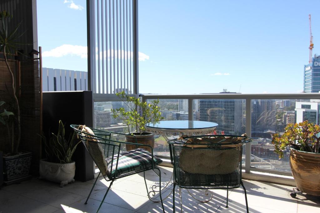 A balcony or terrace at Church St Accommodation in Parramatta CBD