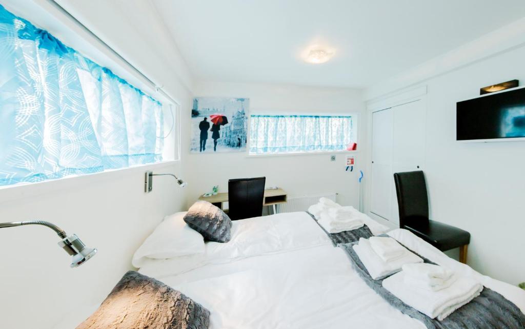 Postel nebo postele na pokoji v ubytování Guesthouse 77