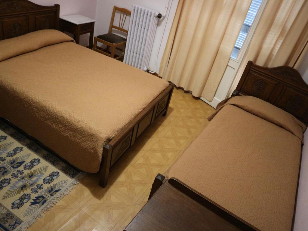 Postel nebo postele na pokoji v ubytování Acropolis House