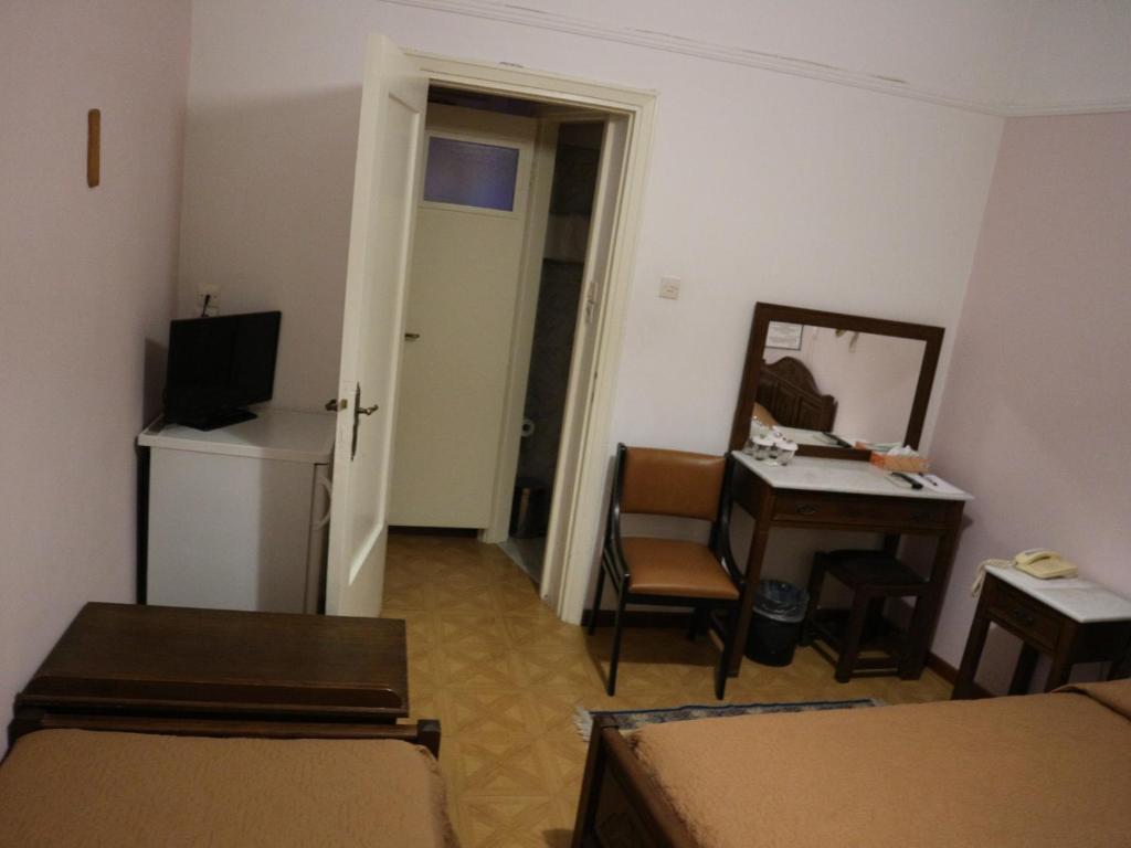TV a/nebo společenská místnost v ubytování Acropolis House