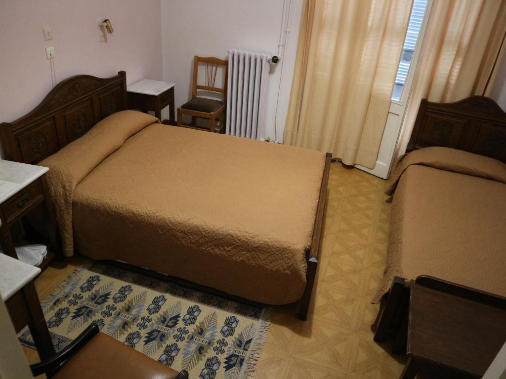 Postel nebo postele na pokoji v ubytování Acropolis House