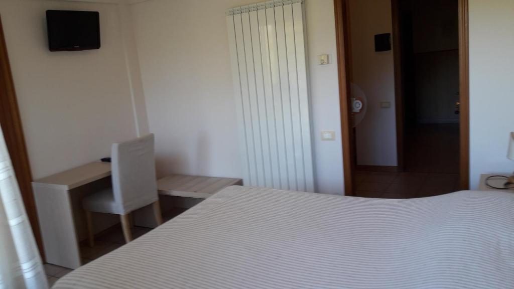 Postel nebo postele na pokoji v ubytování Albergo Nyers