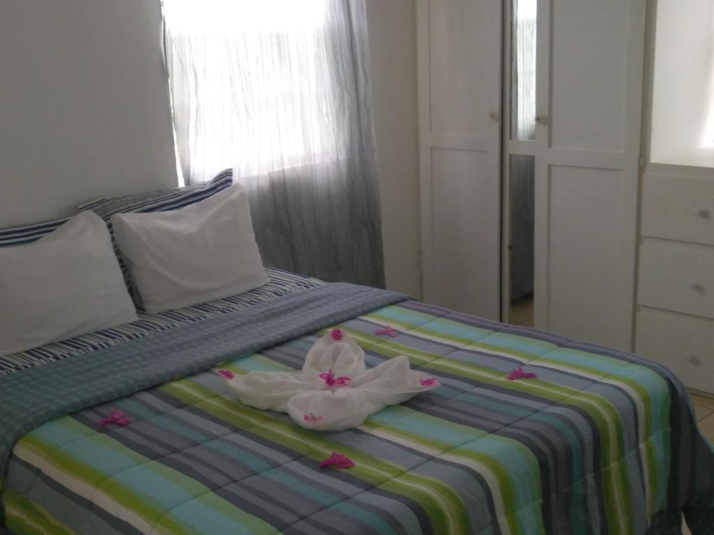 Letto o letti in una camera di Caribbean Dream Vacation Property CD1