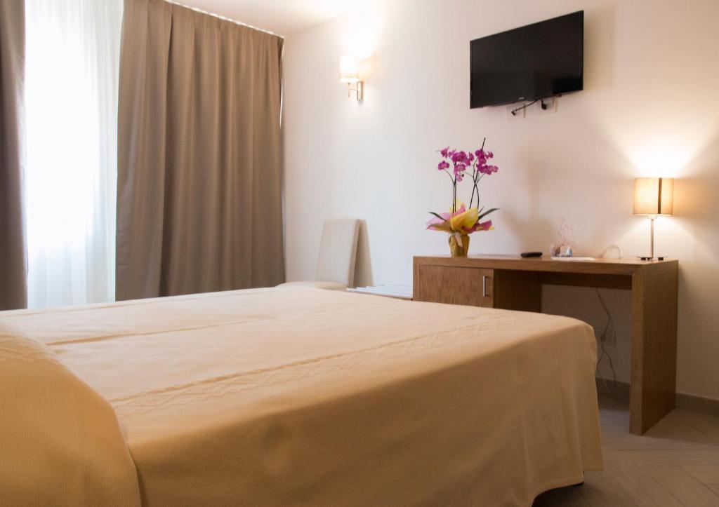 Postel nebo postele na pokoji v ubytování Hotel Maria