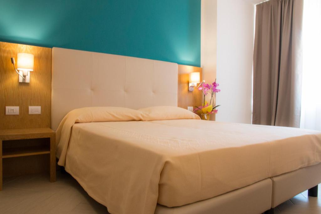 Postel nebo postele na pokoji v ubytování Hotel Maria