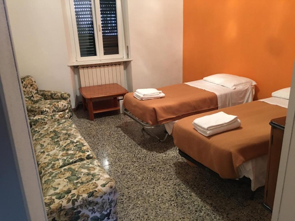 Postel nebo postele na pokoji v ubytování Hotel Concordia