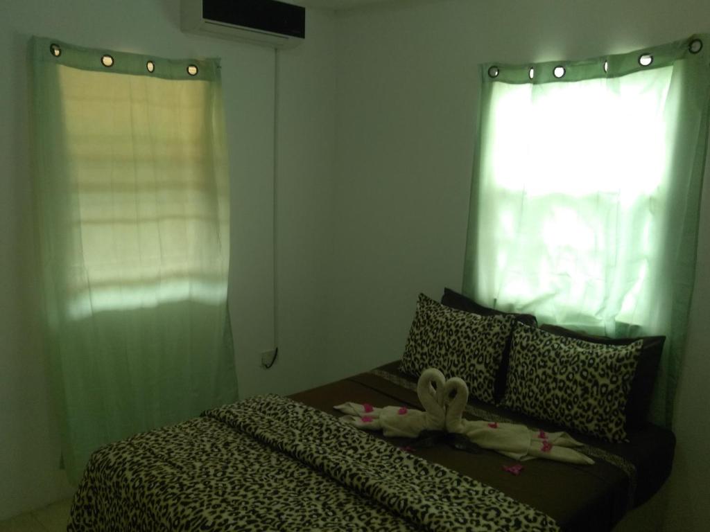 Letto o letti in una camera di Caribbean Dream Vacation Property CD1