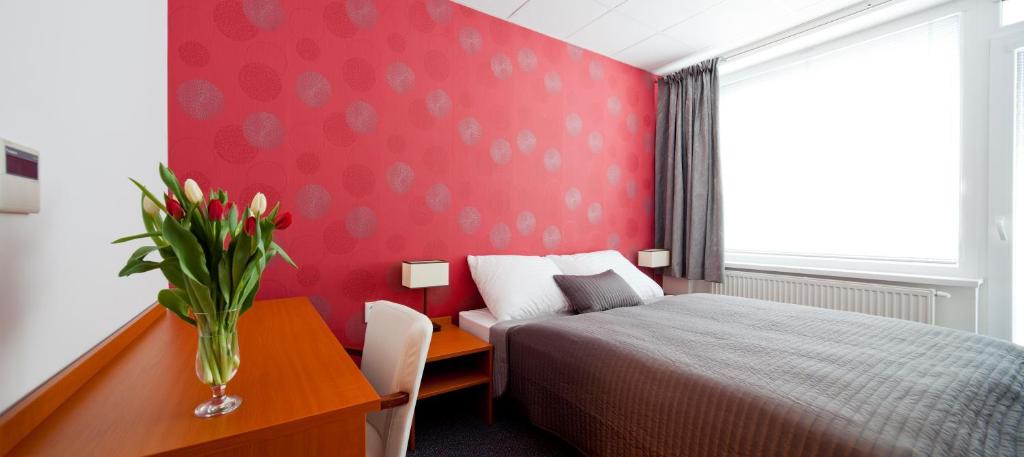 Postel nebo postele na pokoji v ubytování Hotel Limba CTT