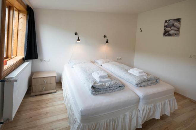 Postel nebo postele na pokoji v ubytování Guesthouse Storu-Laugar
