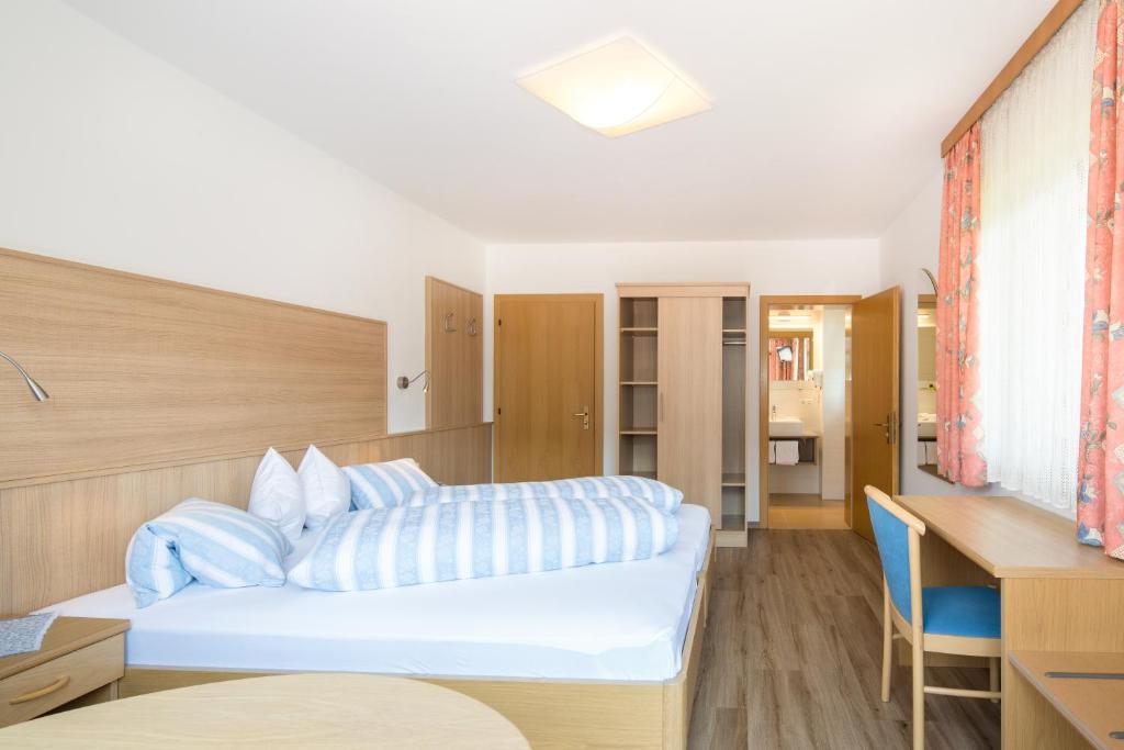 Postel nebo postele na pokoji v ubytování Hotel B&B Martha