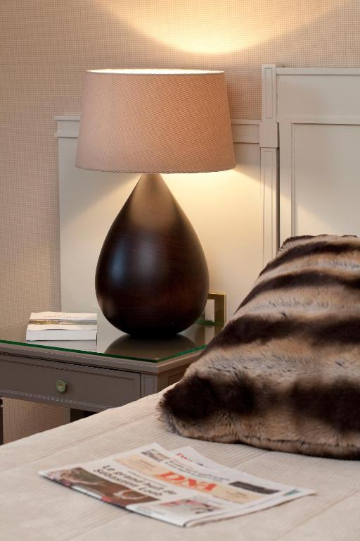 Postel nebo postele na pokoji v ubytování Logis Hotel Le Parc & Spa