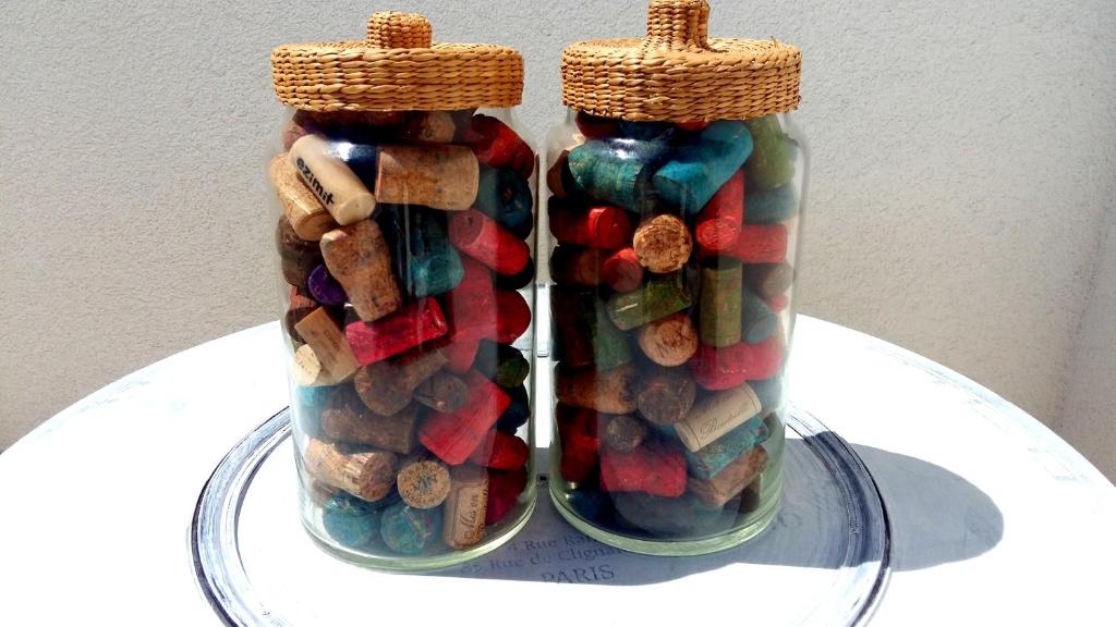 two glass jars filled with different types at Apartments House of Art in Nin