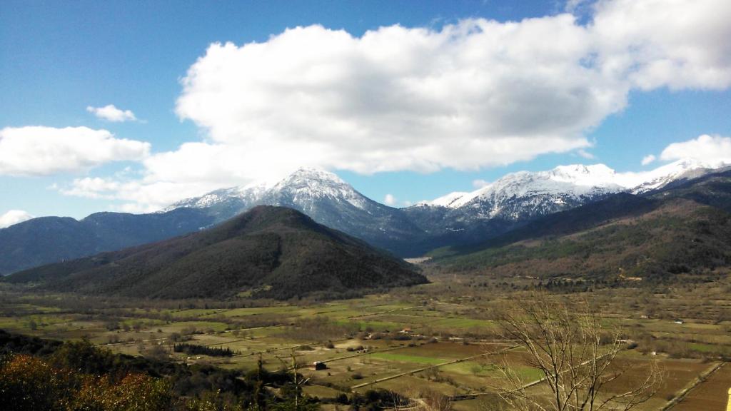 a view of a mountain range with snow capped mountains at Olvios Hotel in Goura