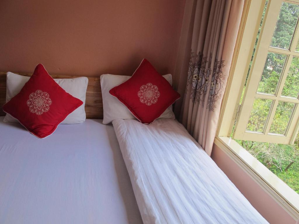 Postel nebo postele na pokoji v ubytování Sapa Backpacker Hostel