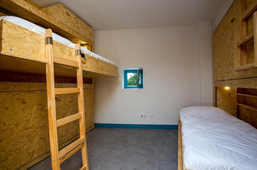 Postel nebo postele na pokoji v ubytování Des Arts