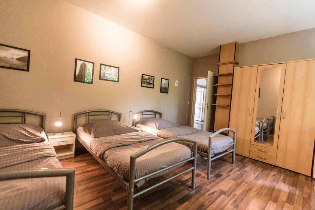 Postel nebo postele na pokoji v ubytování Bergedorf Haus 9