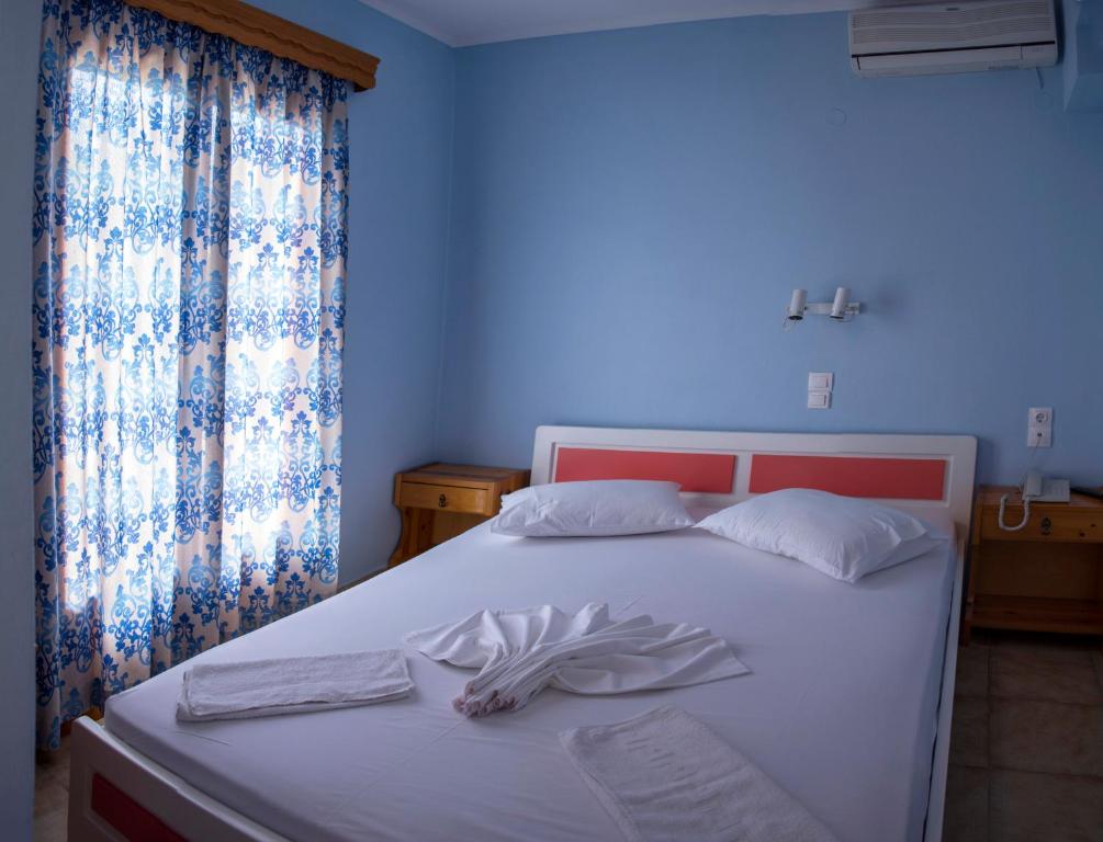 Postel nebo postele na pokoji v ubytování Pension Dimitris