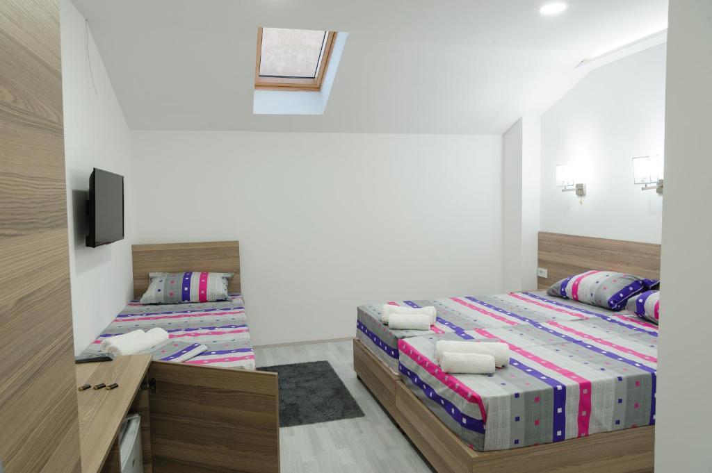Postel nebo postele na pokoji v ubytování Atina Lux Hostel
