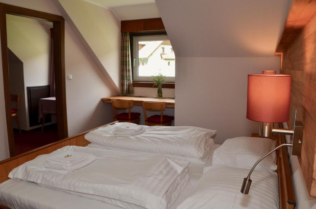 Postel nebo postele na pokoji v ubytování Locus Malontina Hotel