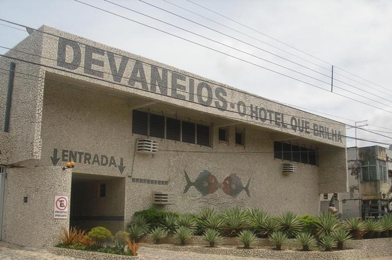 a building with a sign on the side of it at Motel Devaneios (Adult Only) in Recife