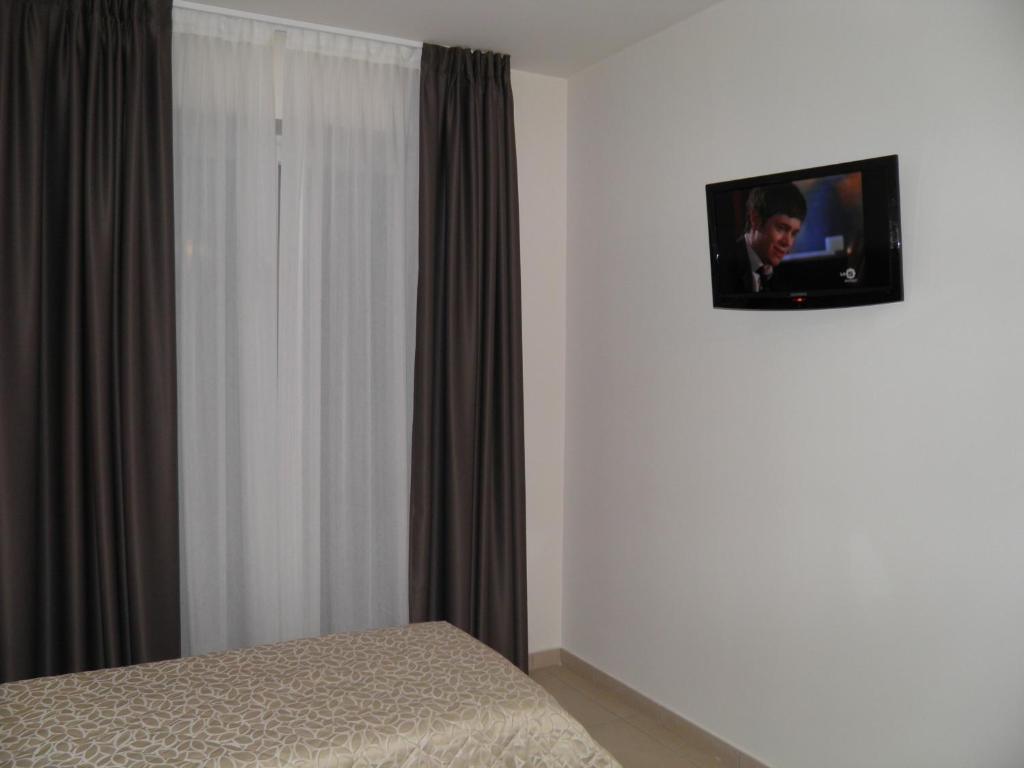 TV a/nebo společenská místnost v ubytování Hotel I Crespi