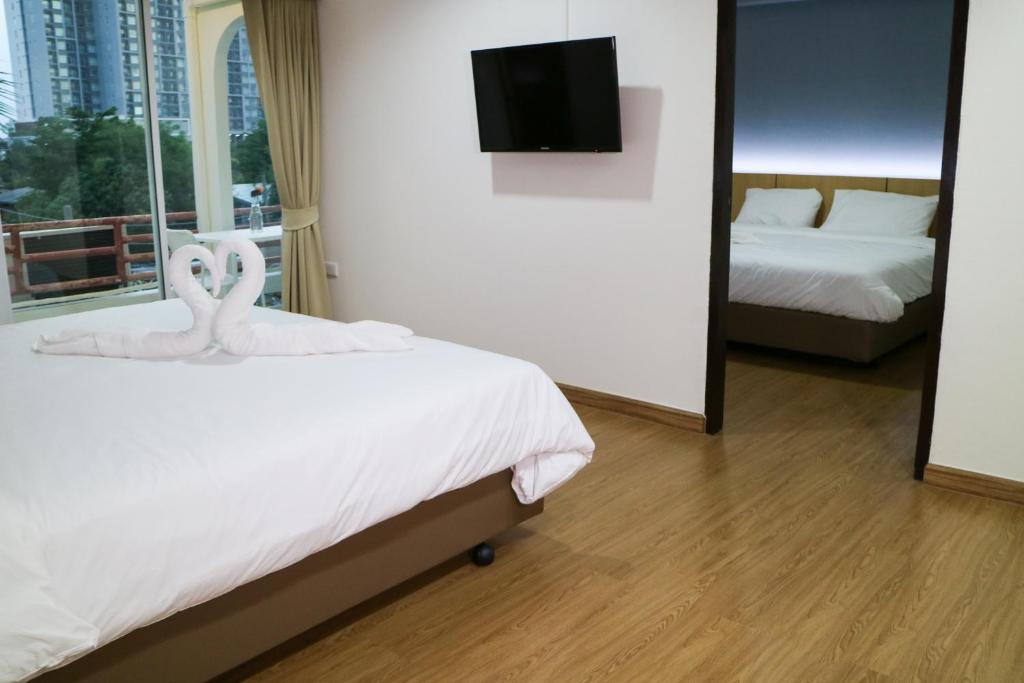 Ένα ή περισσότερα κρεβάτια σε δωμάτιο στο Beerapan Hotel