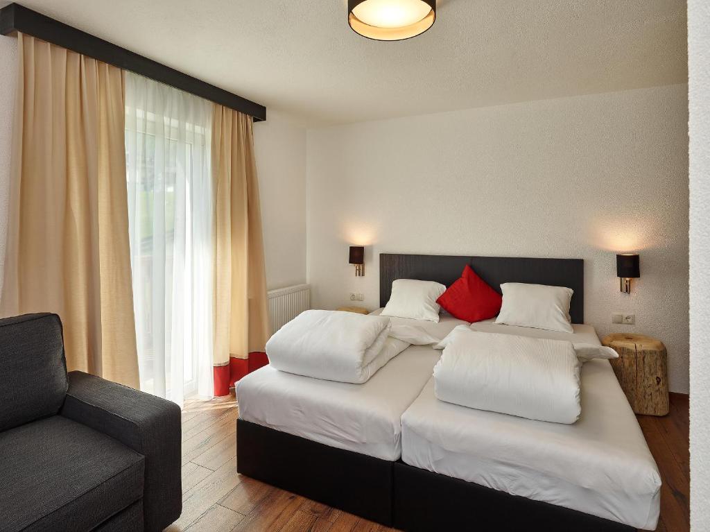A bed or beds in a room at A CASA Opal Appartements
