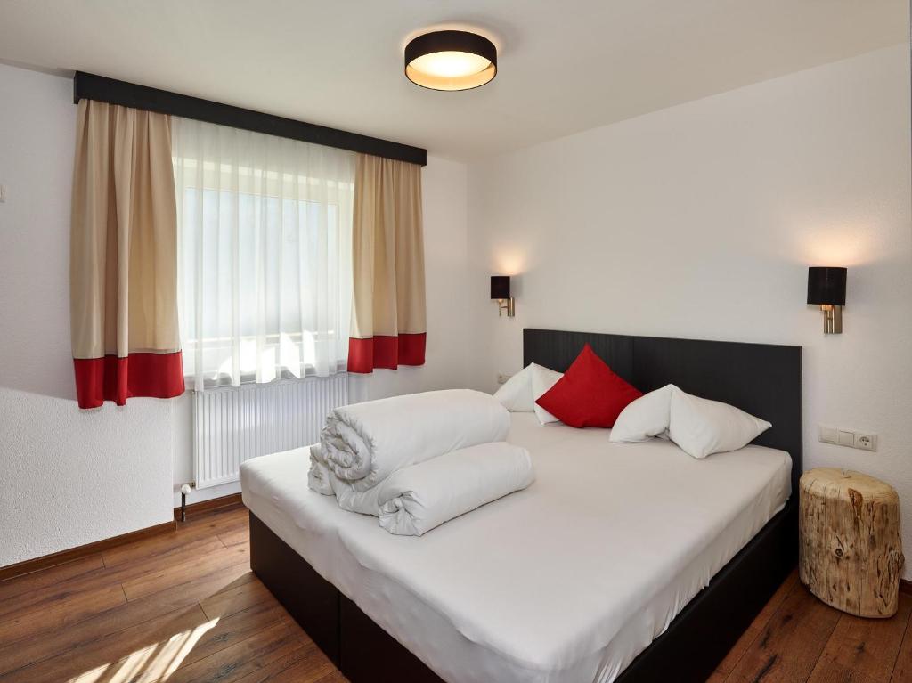 A bed or beds in a room at A CASA Opal Appartements