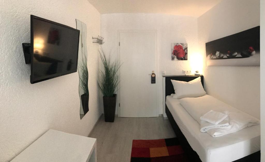 Postel nebo postele na pokoji v ubytování Hotel Berlin