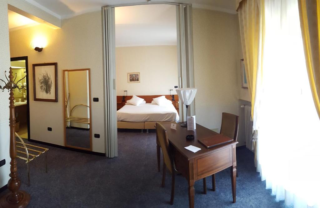 Postel nebo postele na pokoji v ubytování Hotel Ariston