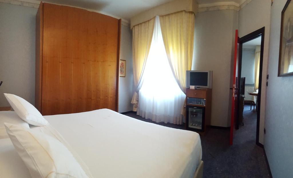 Postel nebo postele na pokoji v ubytování Hotel Ariston