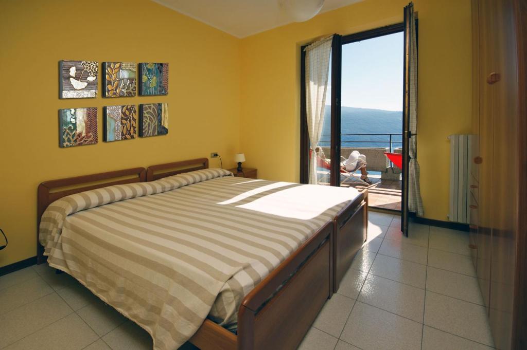 Postel nebo postele na pokoji v ubytování Hotel Residence La Rotonda