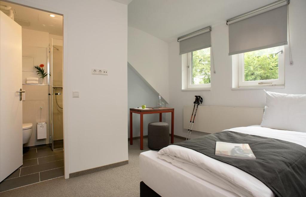 Postel nebo postele na pokoji v ubytování Hotel Christophorus