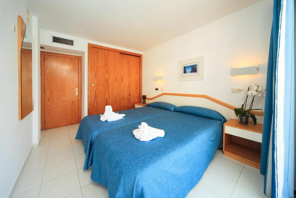 Postel nebo postele na pokoji v ubytování Maracaibo Aparthotel