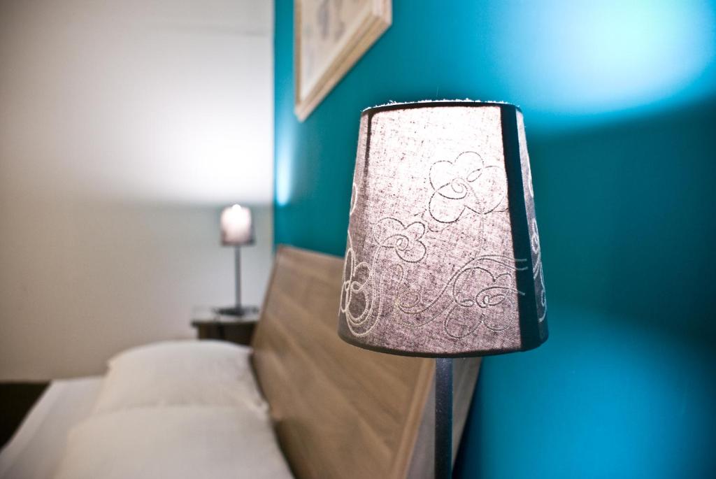 Postel nebo postele na pokoji v ubytování Metropolis B&B